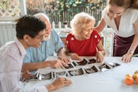 Woman Showing Pregnancy Ultrasound Results to Relatives