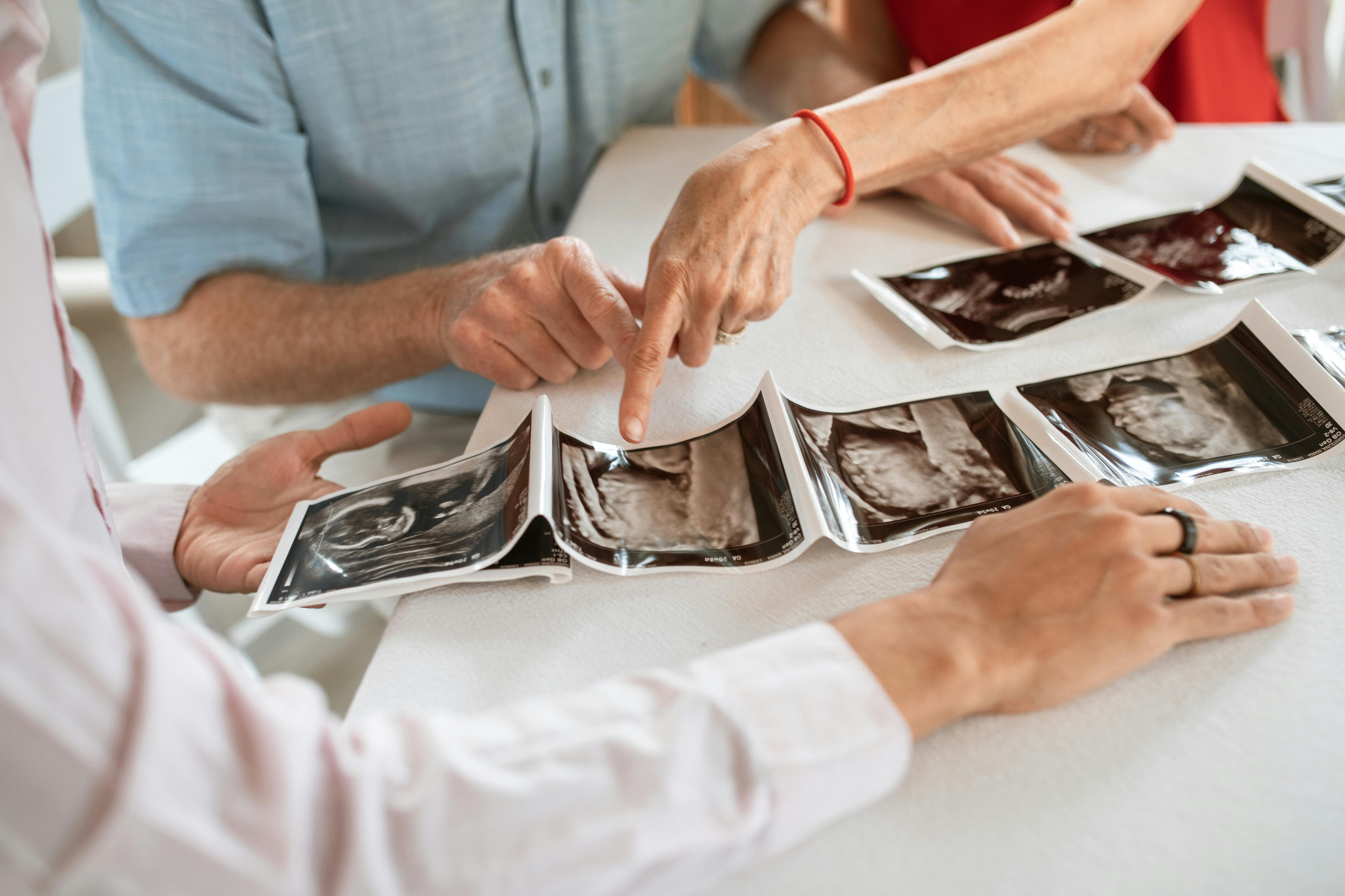 person in white dress shirt holding silver tray