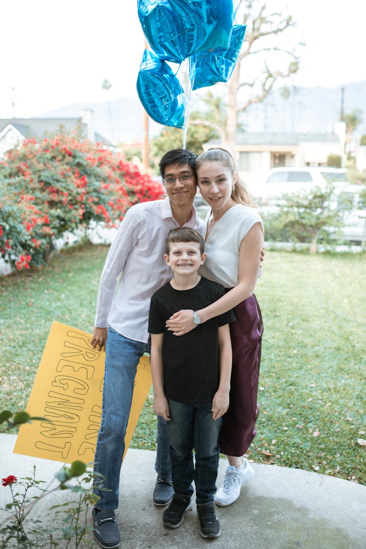 Man Holding A Cardboard Announcing We Are Pregnant