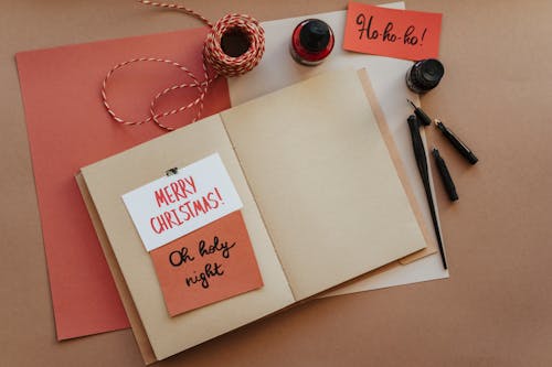 Christmas Cards on Brown Notebook