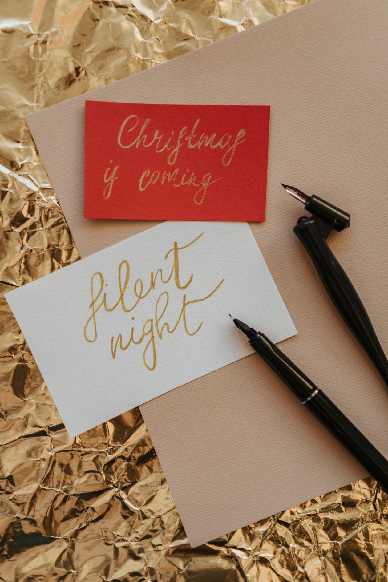 A writer's desk with pen, notebook, and ink bottles — considered gifts for writers