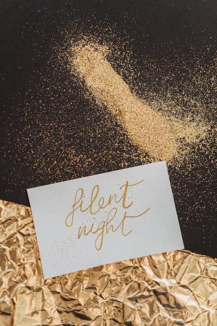 Silent Night Note Beside Glitters