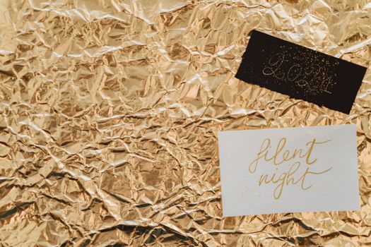 A festive New Year 2021 card with stylish calligraphy on gold foil paper.
