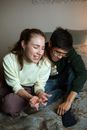 A Woman Holding a Pregnancy Test Kit Beside a Man