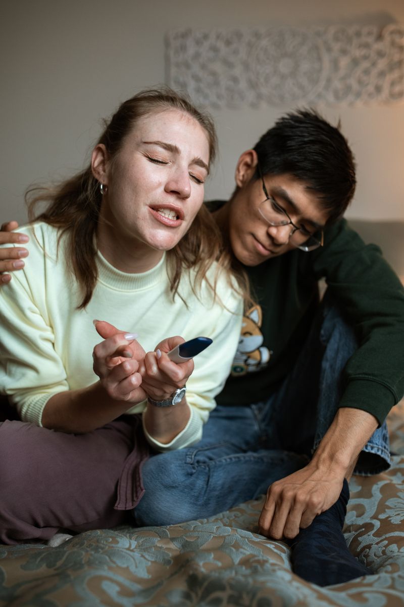 Couple waiting together while holding a home pregnancy test