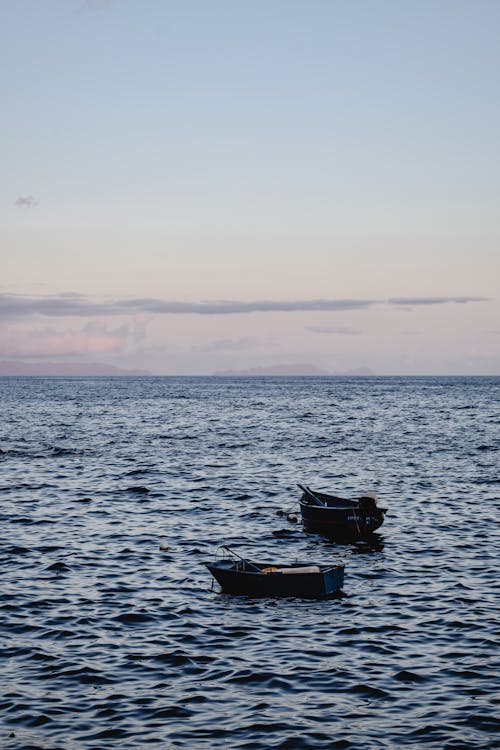 Wooden Boats Anchored on Sea