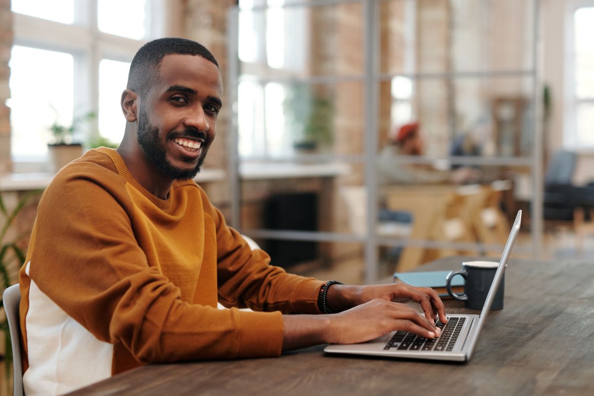 Person calmly reviewing financial options and credit details on a laptop