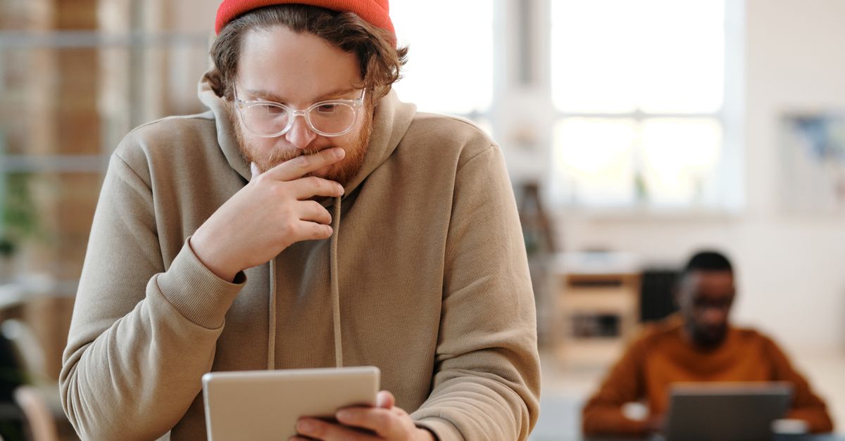 Man Using Devices Men Using Electronic Devices Indoors · Free Stock Photo