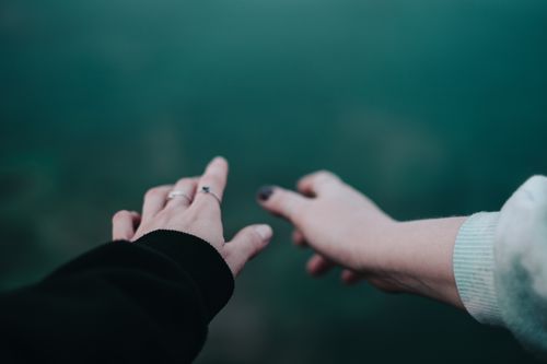 Free Artistic close-up of two hands reaching out, symbolizing connection and togetherness. Stock Photo