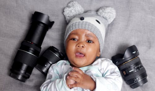Photos gratuites de bébé garçon, lentilles canon