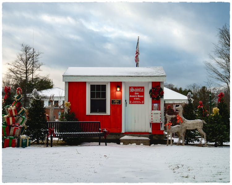 Small Modern Santa House With USA Flag And Festive Decorations