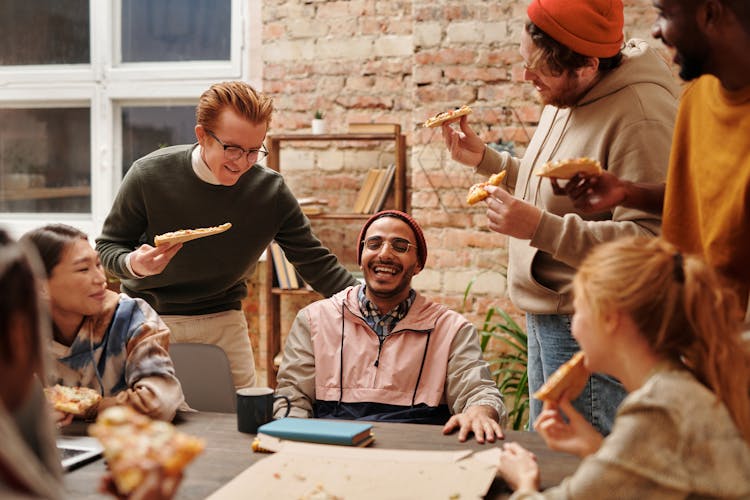 
Happy People Eating Pizza