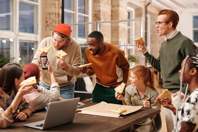 People Eating Pizza In The Office