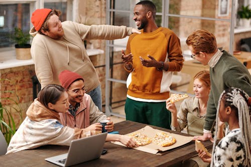 Free Multiracial Group of People by the Table Stock Photo