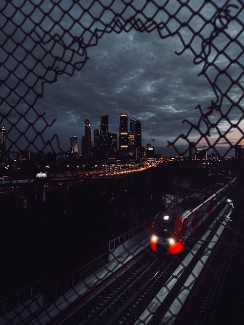 
A View of a Train and a City at Night