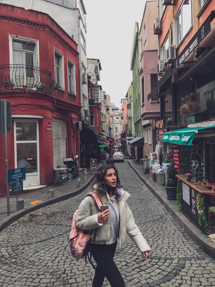 Woman Wearing Jacket Walking On The Street