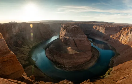 Horseshoe Bend curling around red cliffs above the Colorado River