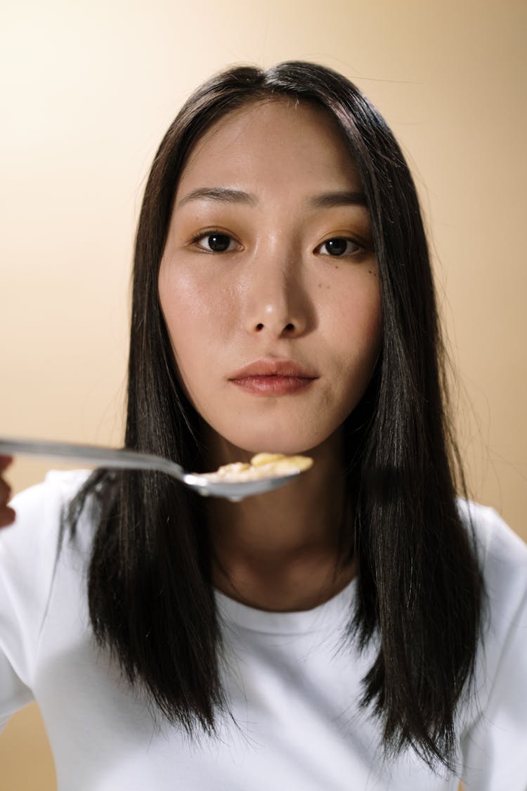 A Woman Eating Cereal