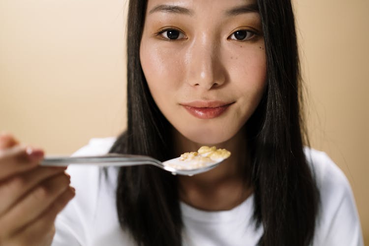 A Woman Eating Cereal 