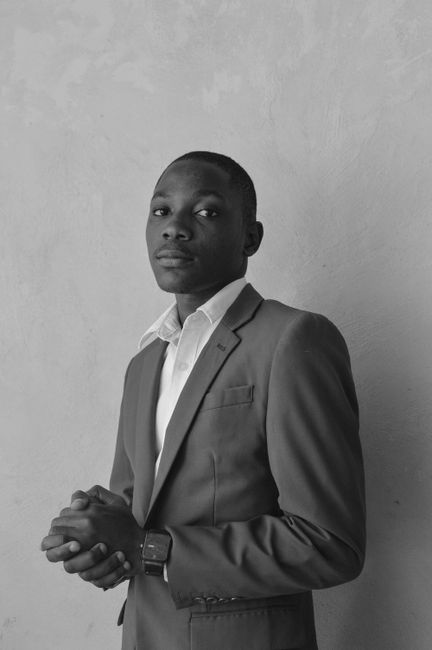 Grayscale portrait of a confident man in a suit. Perfect for business or professional themes.