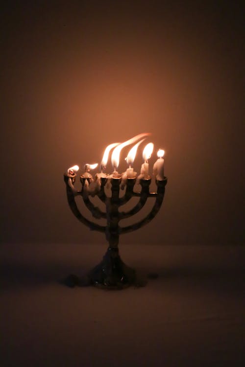 Free Lighted Candle On A Candle Holder Stock Photo