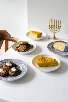 A festive Hanukkah table setup featuring traditional dishes and a menorah in London.