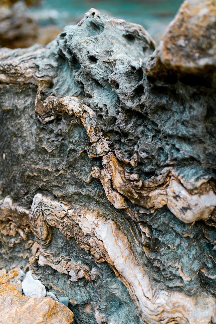 Vertical Shot Of A Stone Green Yellow Layered Texture