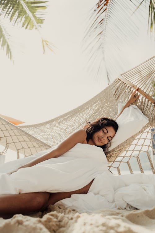 Free Woman Lying Beside a Hammock Stock Photo