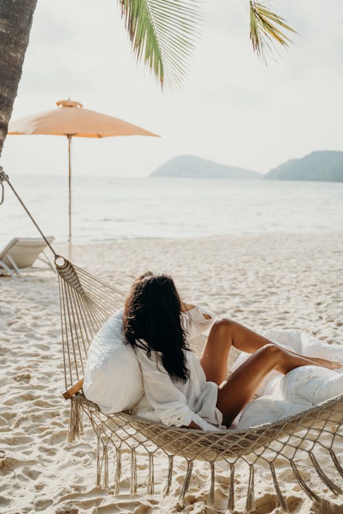 Free A Woman in a Hammock at the Beach  Stock Photo