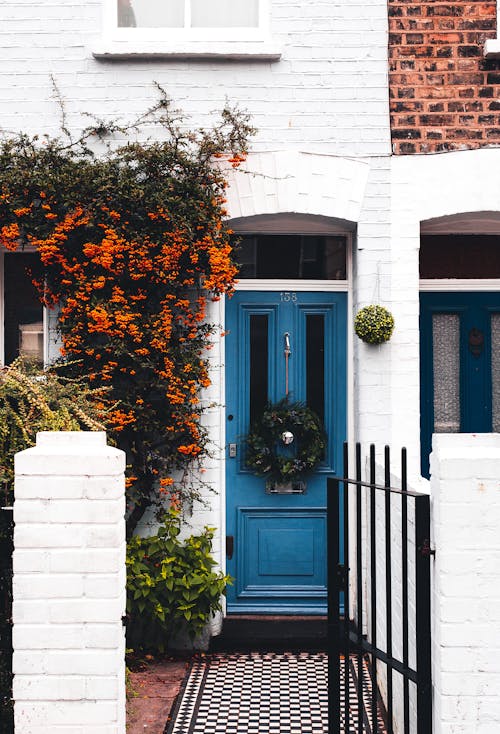  Blue Wooden Door in White Townhouse