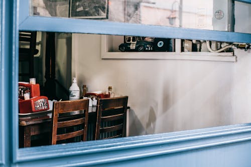 Opened window of cafe with old interior