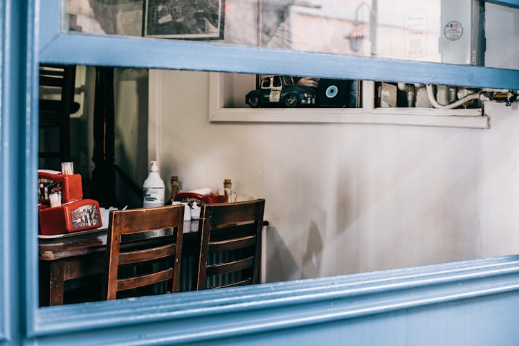 Opened Window Of Cafe With Old Interior