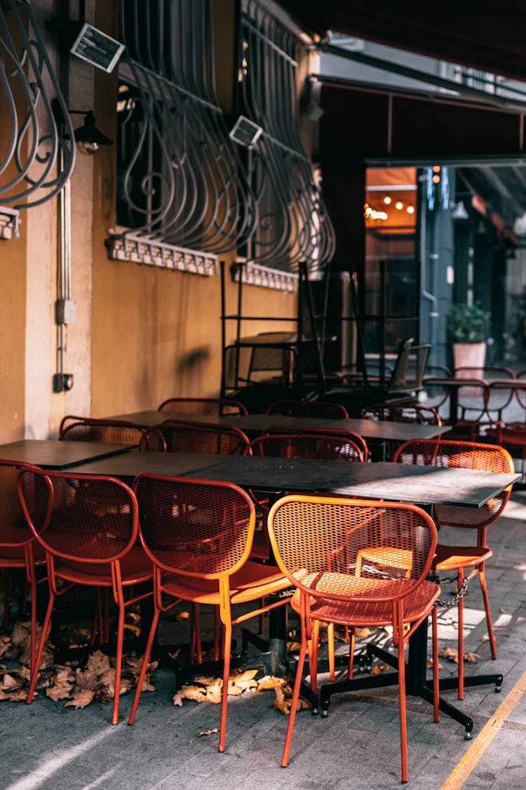 Old Empty Street Cafe With Chairs And Tables