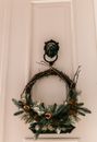 Decorative door wreath hanging on lion knocker