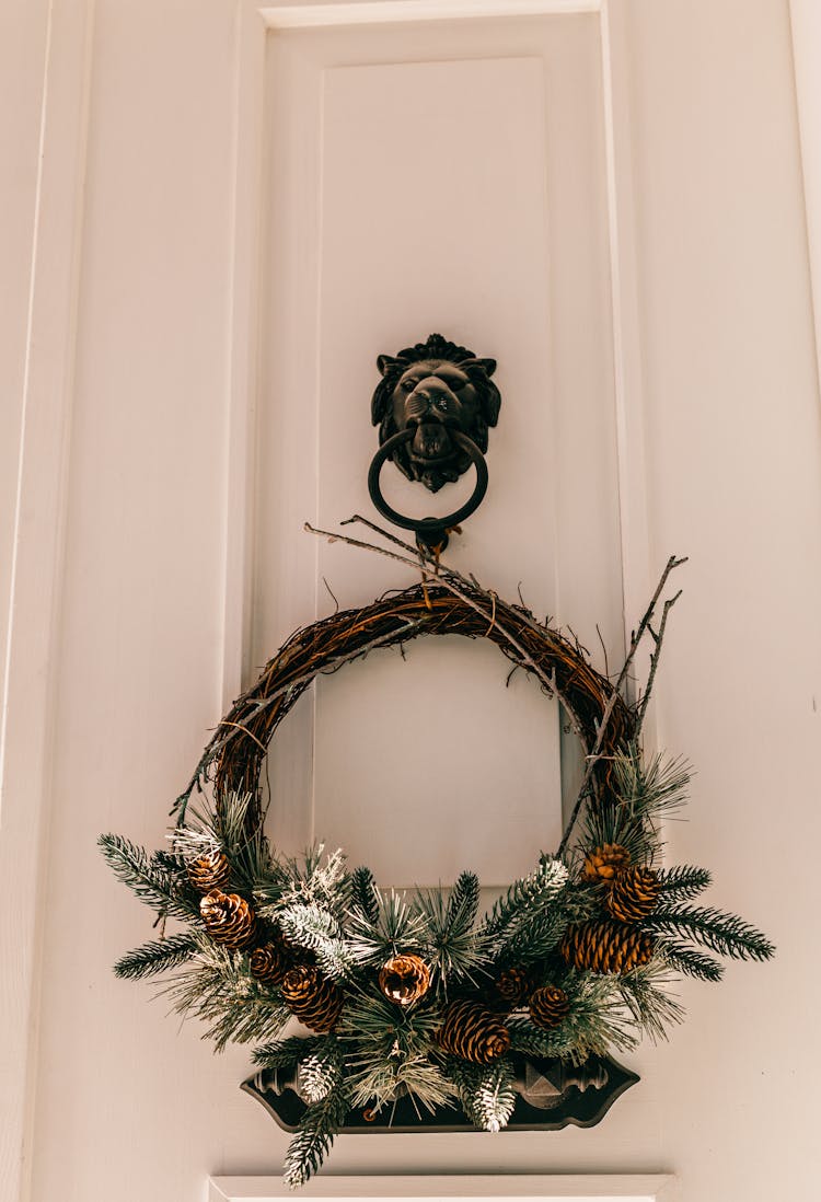 Decorative Door Wreath Hanging On Lion Knocker