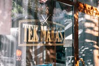 Exterior of barbershop with signboard