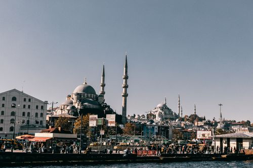 Free Medieval Hagia Sophia cathedral with dome located on crowded embankment near sea in Istanbul city in Turkey against blue sky Stock Photo