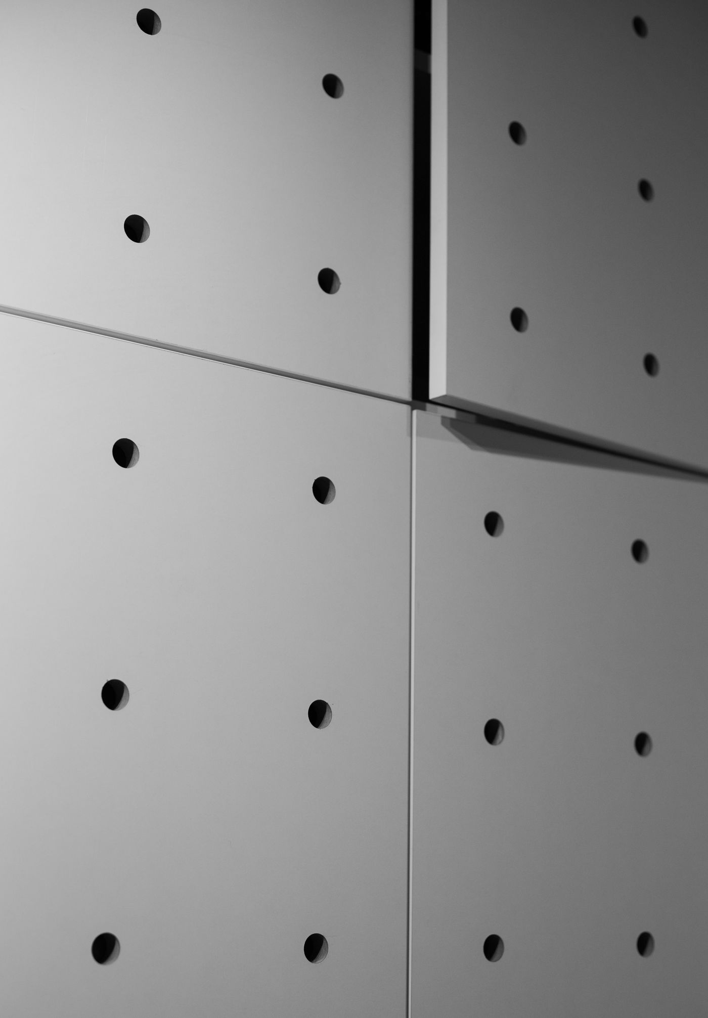 Close view of modular perforated acoustic wall panels