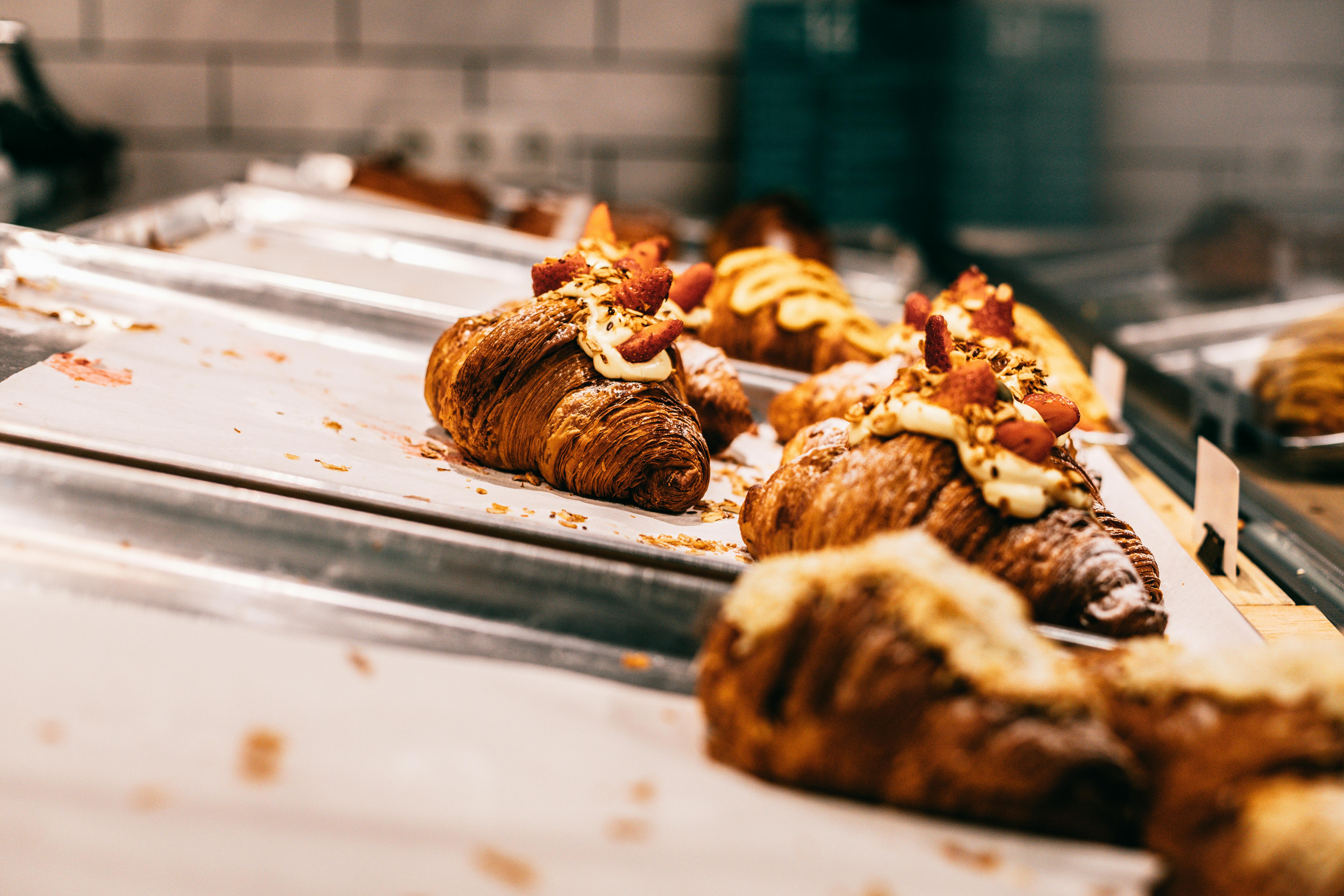 delicious baked croissants on trays