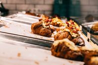 Delicious baked croissants on trays