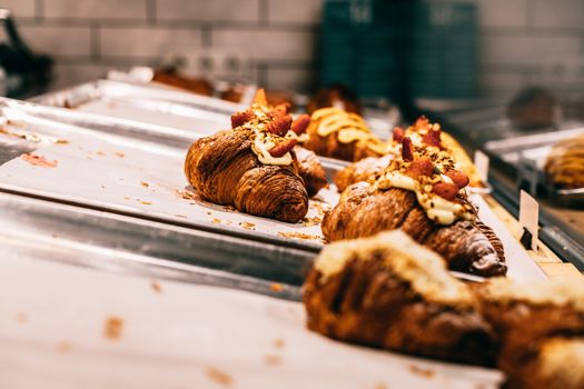 Delicious baked croissants on trays