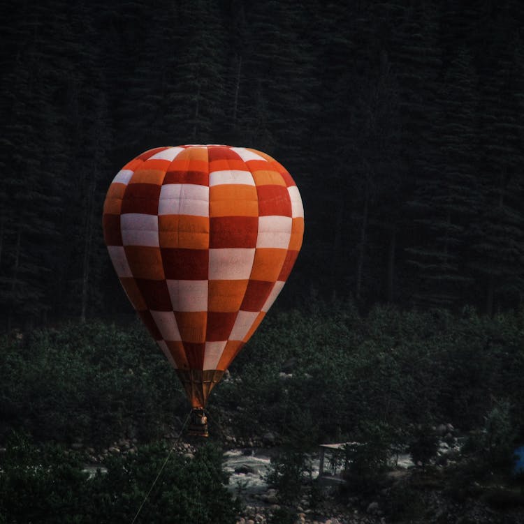 White, Orange And Red Hot Air Balloon Flying