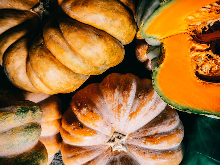 Ripe Organic Pumpkins Heaped On Plastic Surface