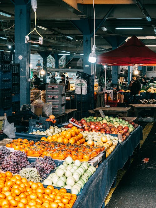 Modern roofed indigenous food market and stalls filled with ripe fruits and organic vegetables