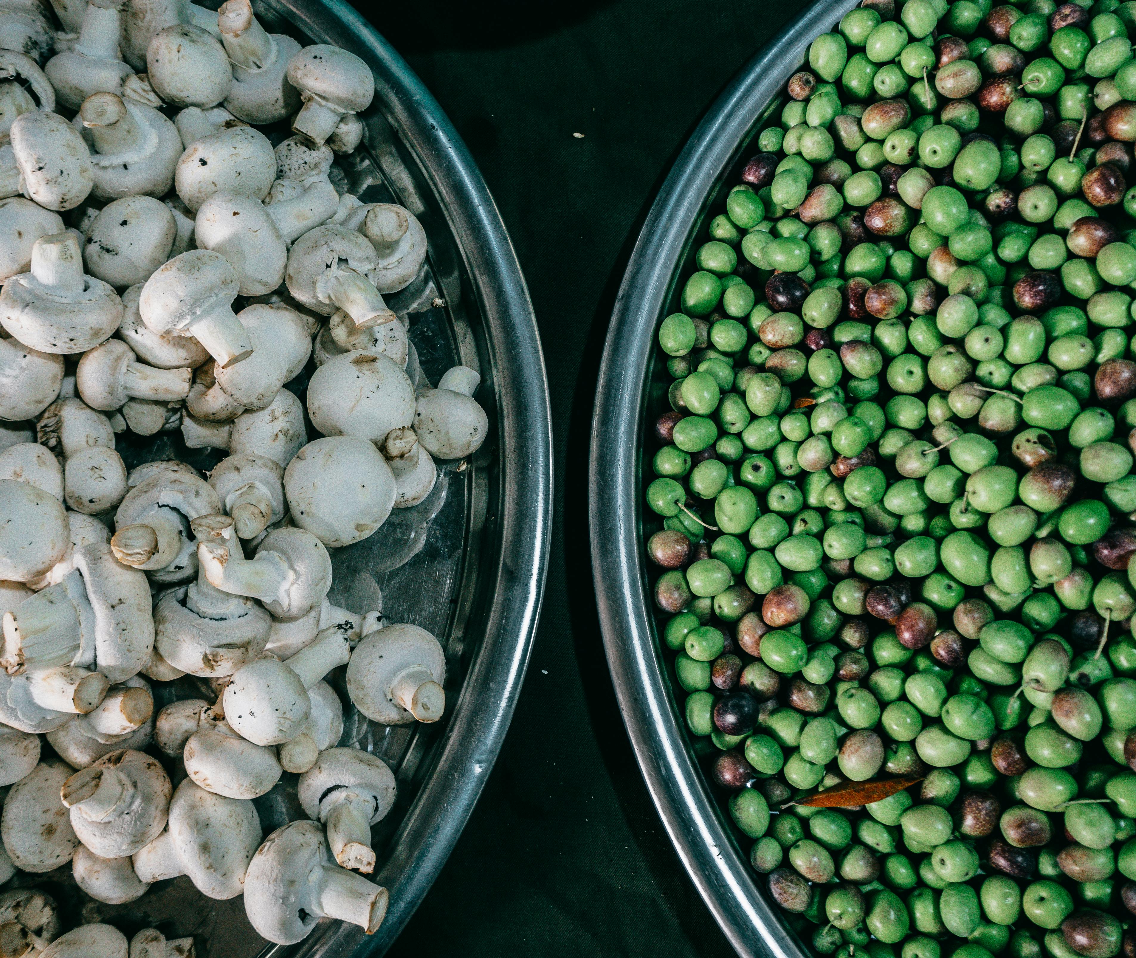 bowls with green peas and mushrooms