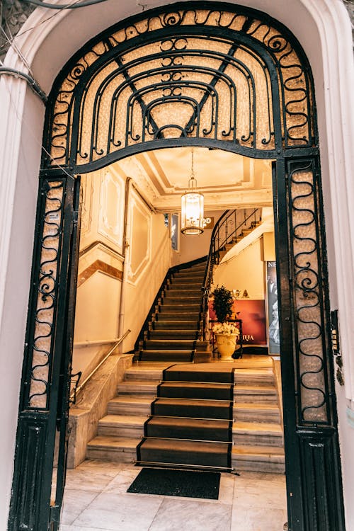 Grand mansion staircase near ornamental entrance
