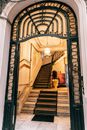 Grand mansion staircase near ornamental entrance