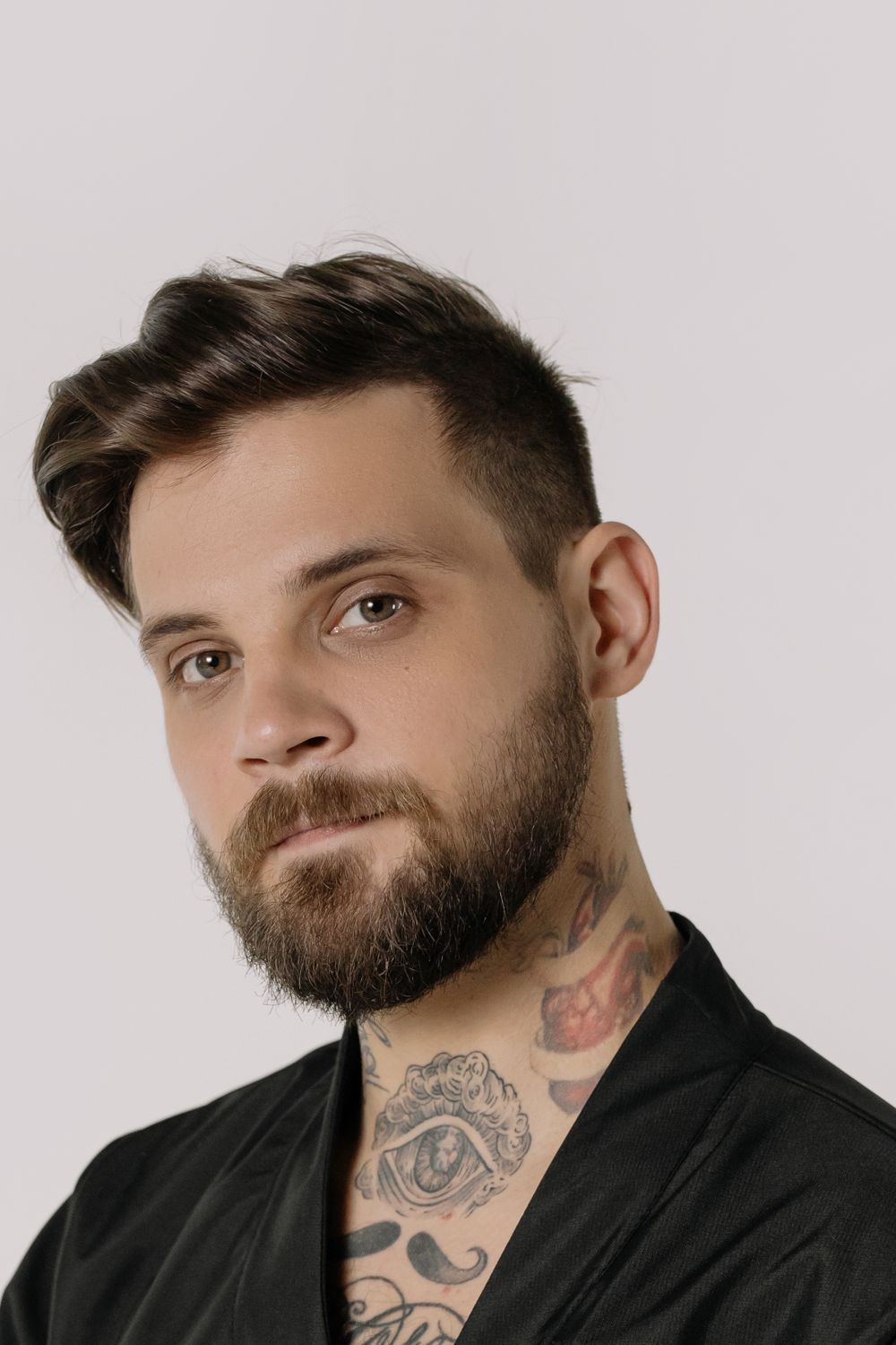 Close-Up Shot of a Bearded Man in Black Shirt · Free Stock Photo
