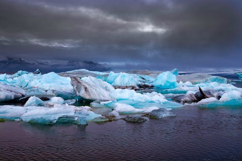 Ice on Water Under Cloudy Sky