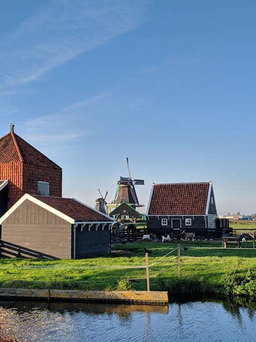 Farmhouse and Windmill by the River 
